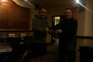 Iain McDermott left receiving the prize from Tim Ross (squash convener)